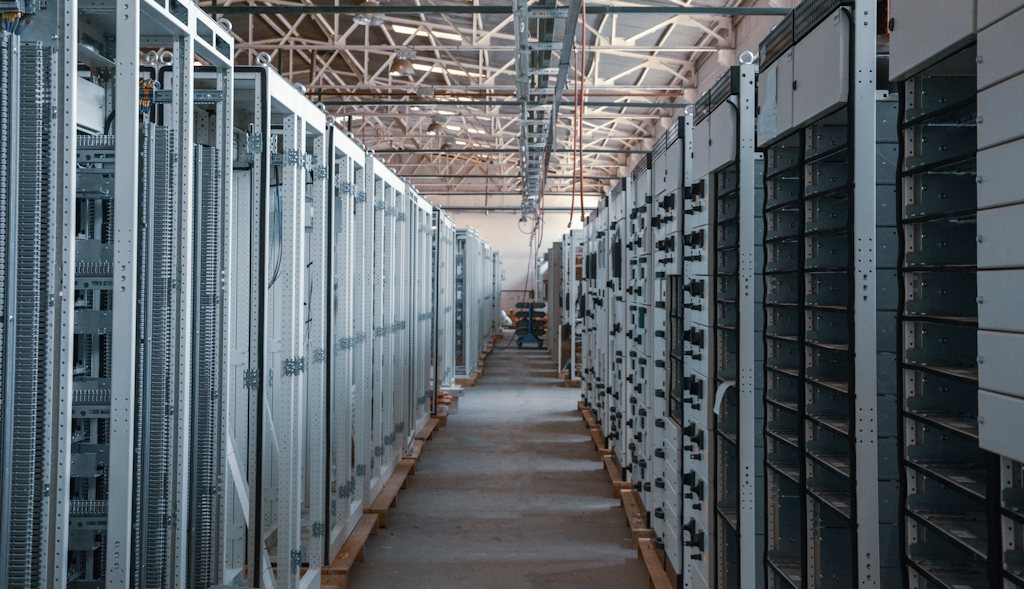 Rows of electrical cabinets in an industrial hall